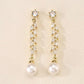 Gold-plated leaf design bridal earrings with sparkling crystals and pearl