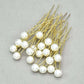 Detailed view of the handmade Gold pin and lustrous pearl