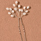 Detail of the lustrous pearls on the delicate branch hair pin