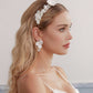Skillfully handcrafted, these flower bridal earrings are the perfect complement to our signature porcelain headpieces. Each earring is exquisitely made by hand, featuring two delicate white clay flowers adorned with freshwater pearls.
