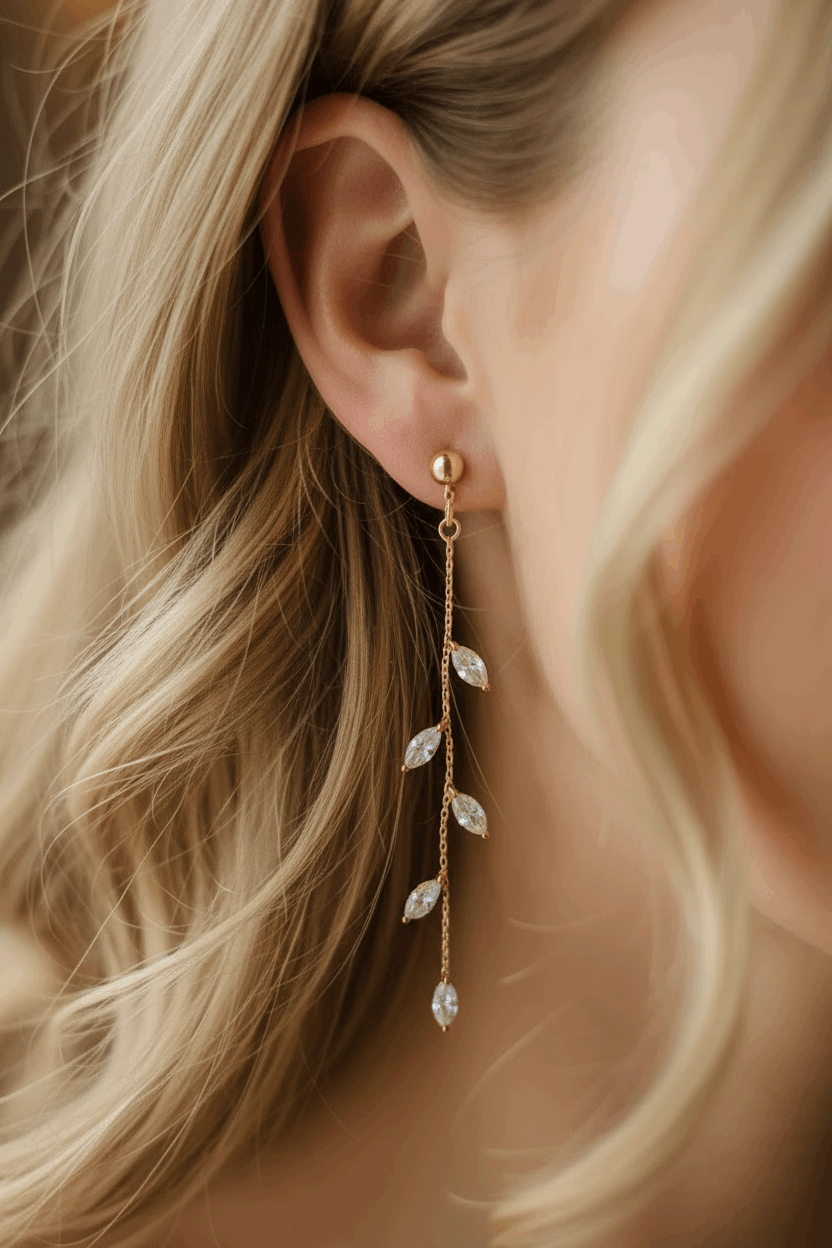 14K Gold Olive Leaf Crystal Drop Earrings - three quarter face view, half updo hairstyle