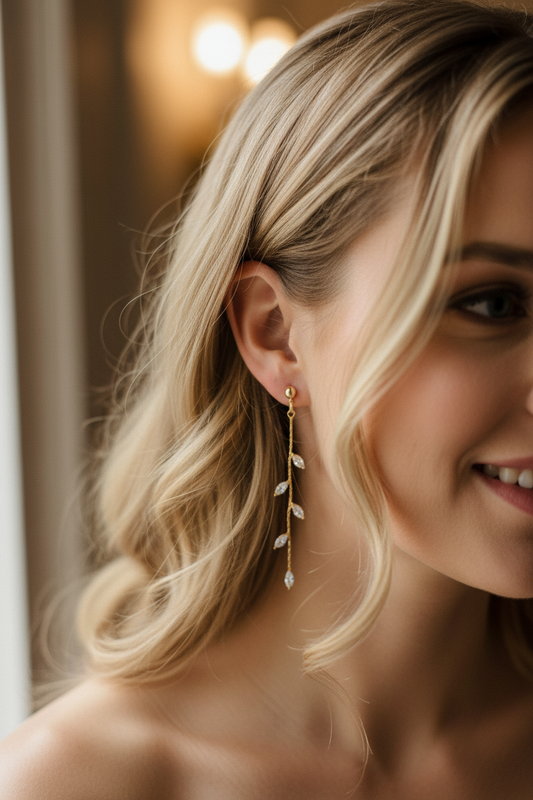 14K gold olive leaf crystal drop earrings worn by bride, elegant bridal styling