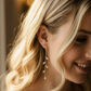 14K Gold Olive Leaf Crystal Drop Earrings - bride head tilted down, earring natural drape