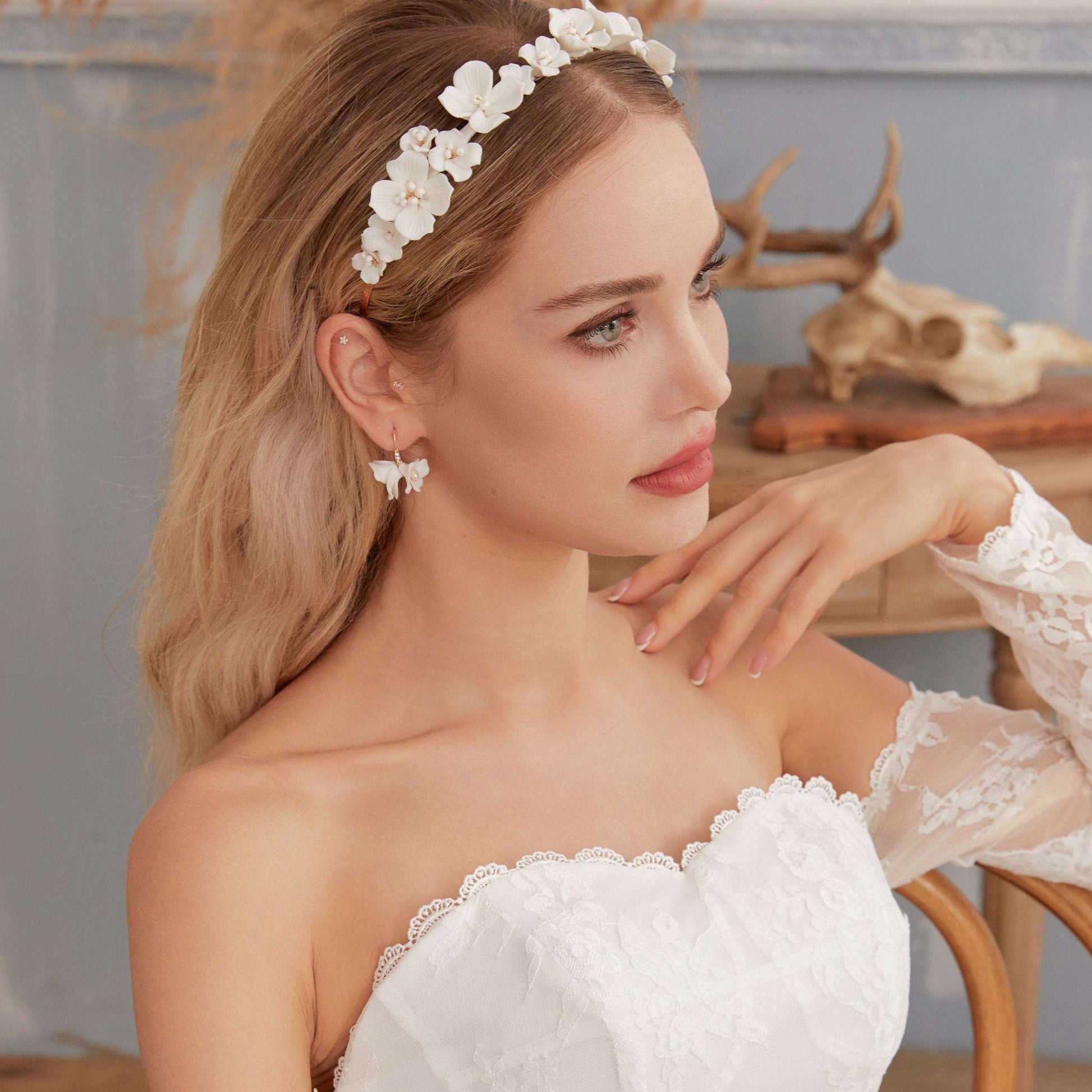 Side profile of a bride wearing the LILY drop earrings and floral headband