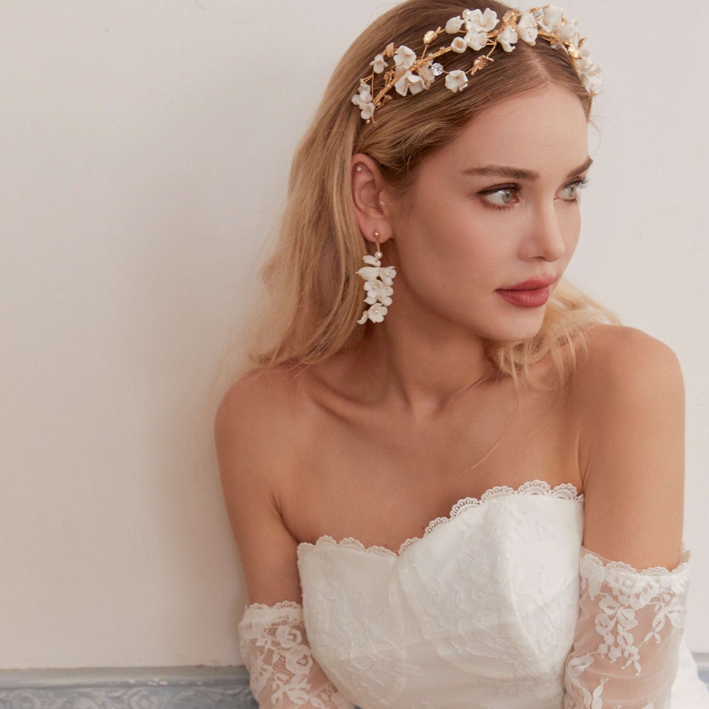 This beautifully hand-sculpted clay & pearl crown features individually crafted cherry blossom flowers, dainty freshwater pearls, and crystals. The result is a full, textured headband that makes a statement while remaining incredibly feminine.