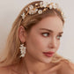 This beautifully hand-sculpted clay & pearl crown features individually crafted cherry blossom flowers, dainty freshwater pearls, and crystals. The result is a full, textured headband that makes a statement while remaining incredibly feminine.