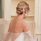 Back view of a bride wearing the OLIVIA earrings with an elegant updo