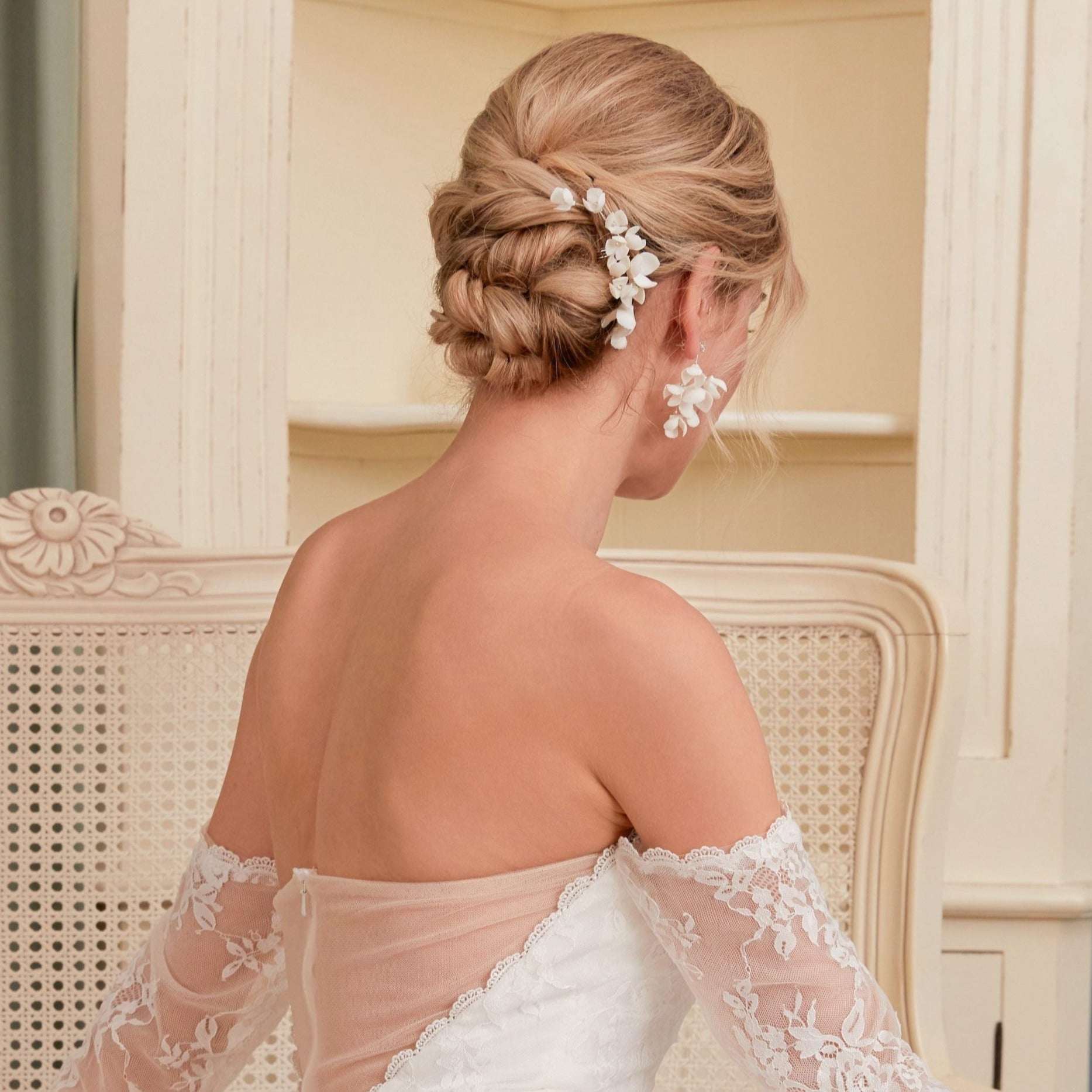 Back view of a bride wearing the OLIVIA earrings with an elegant updo