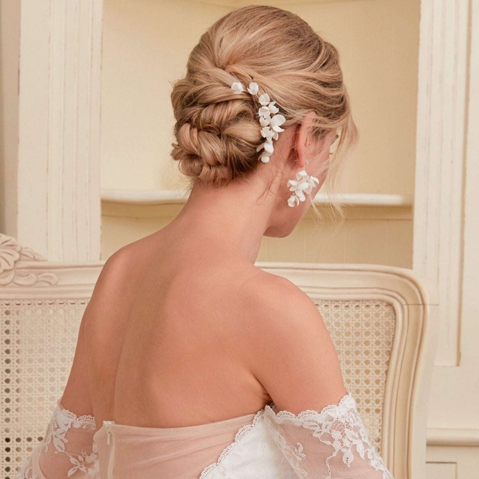 This hair comb is perfect for brides who want a modest and timeless look. It features delicate clay flowers and small beads that are arranged carefully to create a romantic and classic design.