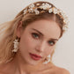 This beautifully hand-sculpted clay & pearl crown features individually crafted cherry blossom flowers, dainty freshwater pearls, and crystals. The result is a full, textured headband that makes a statement while remaining incredibly feminine.