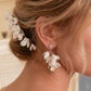 This hair comb is perfect for brides who want a modest and timeless look. It features delicate clay flowers and small beads that are arranged carefully to create a romantic and classic design.