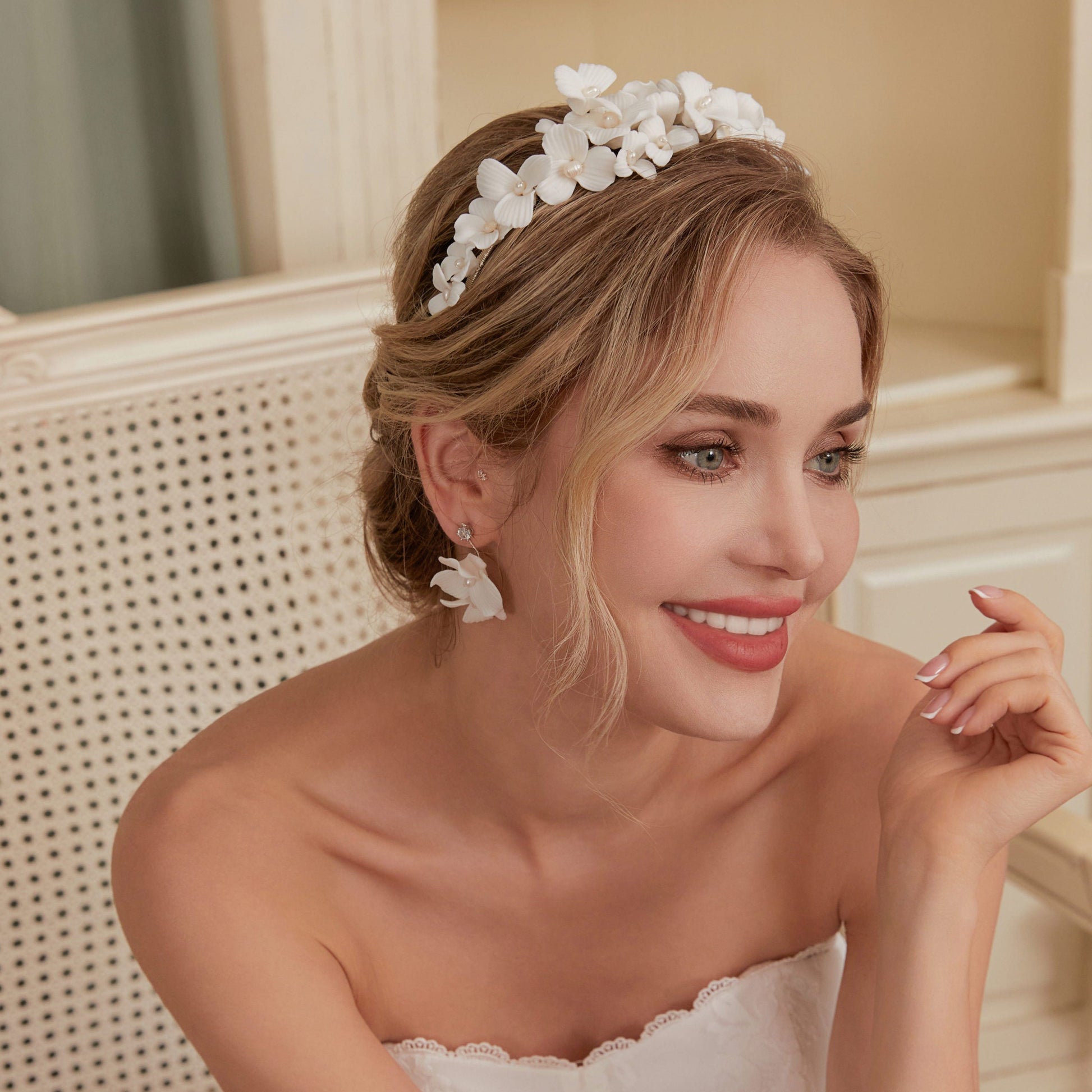 Skillfully handcrafted, these flower bridal earrings are the perfect complement to our signature porcelain headpieces. Each earring is exquisitely made by hand, featuring two delicate white clay flowers adorned with freshwater pearls.