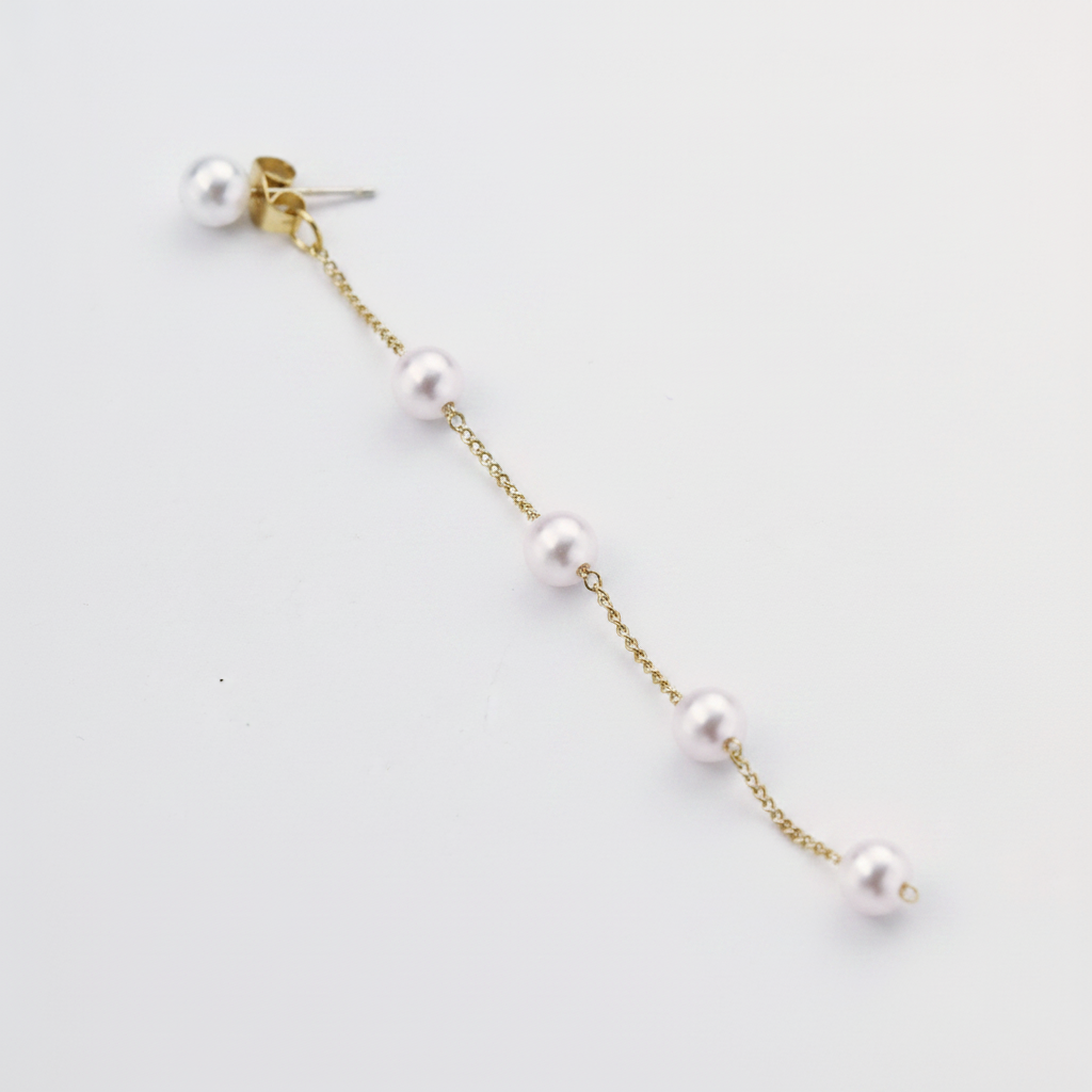 Five natural freshwater pearls on a gold threader earring chain