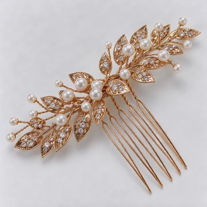 Diagonal product view of the gold leaf bridal comb with branching white bead details