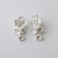 Handmade white ceramic flower drop earrings with bead details, 5-6cm length, bridal wedding jewellery