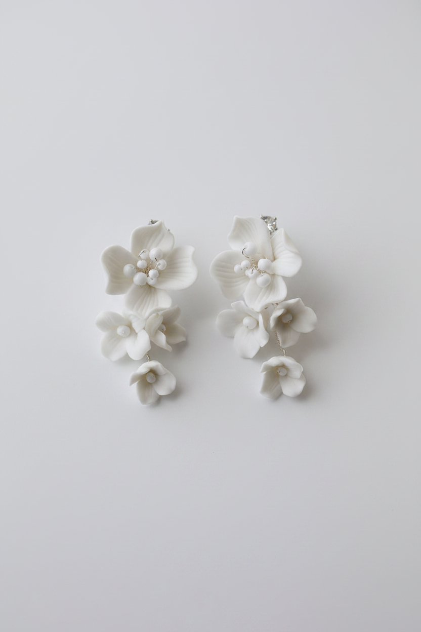 Handmade white ceramic flower drop earrings with bead details, 5-6cm length, bridal wedding jewellery