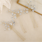 Close-up of the lustrous pearl on the handmade bridal hair pin