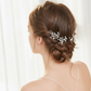 Side view of a bride wearing a delicate pearl hair pin