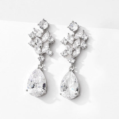 Detail of the teardrop crystal bridal earrings showing the leaf vine design